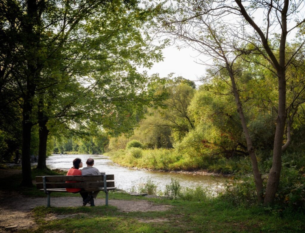 couple on bench by river